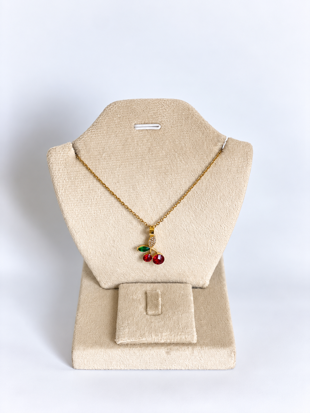 Cherry Pendant on Velvet Bust