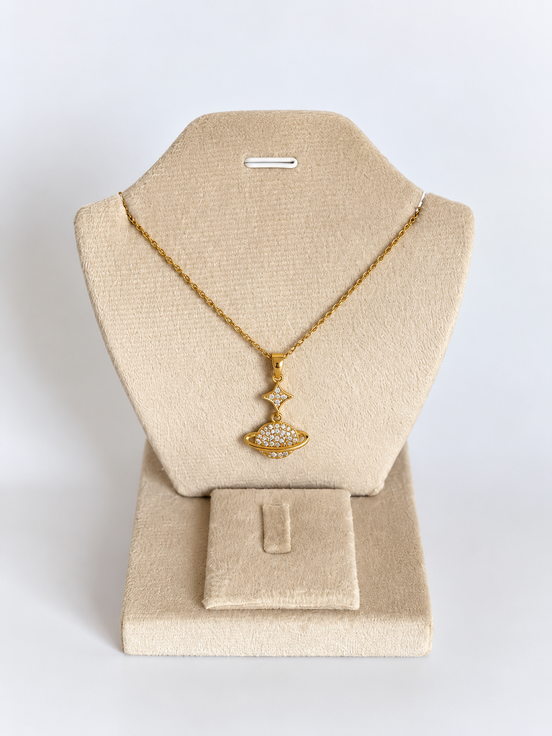 Gold UFO Pendant on Velvet Display